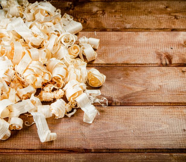 Wood chips on the table. On a wooden background. High quality photo